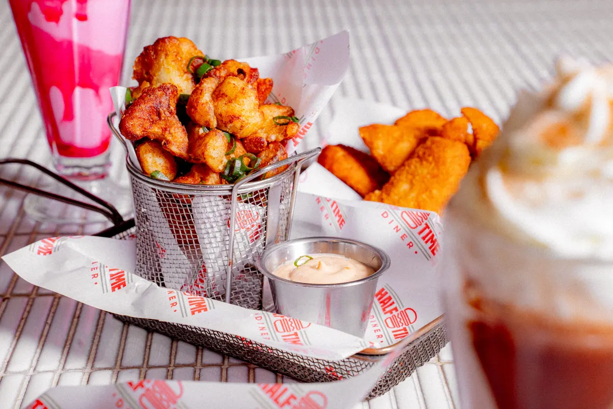 Popcorn chicken bucket with a strawberry milkshake
