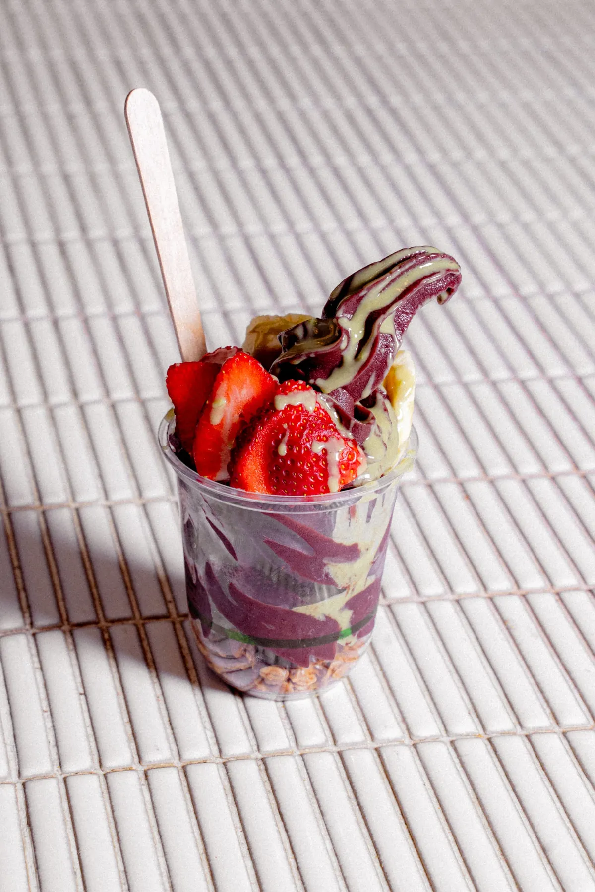 Soft-serve swirl with strawberries and sauce