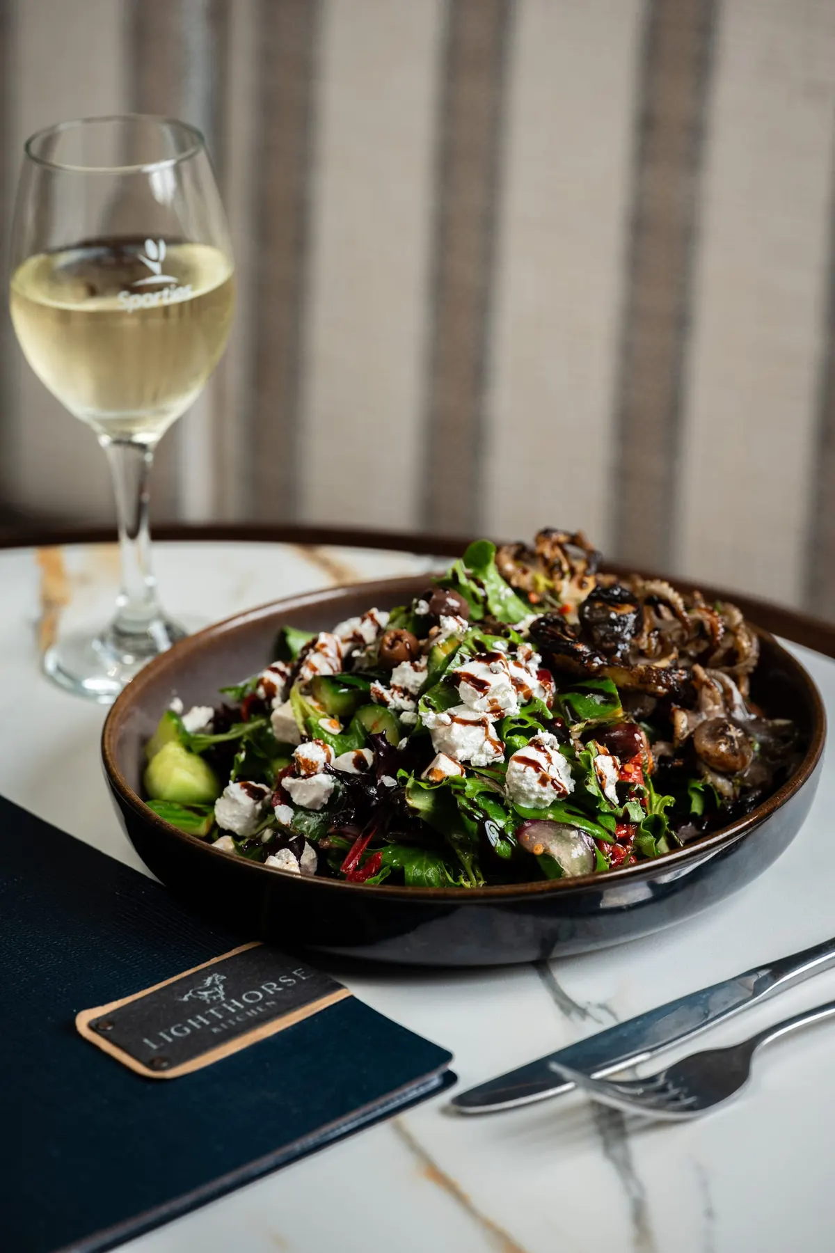 Chargrilled calamari salad with feta, leaves and balsamic